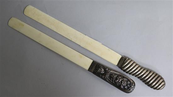 Two silver mounted ivory paper knives, largest 32cm.